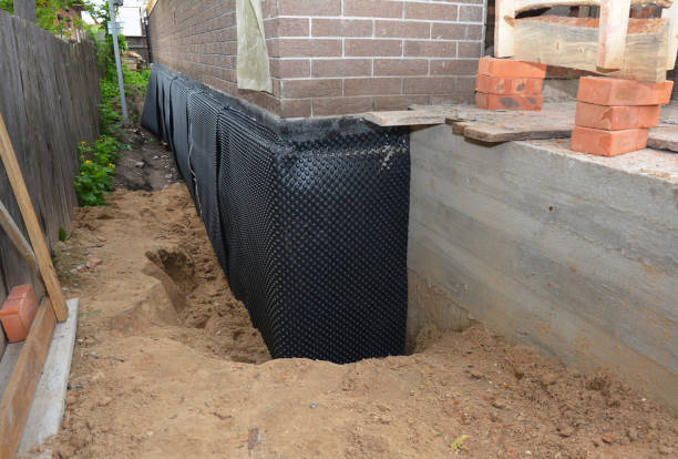 Happy homeowners after waterproofing job in Mount Victory